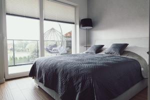 Posteľ alebo postele v izbe v ubytovaní Apartament Rejs