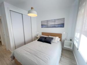 Posteľ alebo postele v izbe v ubytovaní Tarifa Cozy House - Central - Parking - Wifi