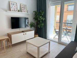 Televízia a/alebo spoločenská miestnosť v ubytovaní Tarifa Cozy House - Central - Parking - Wifi