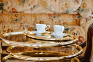 a tray with two coffee cups on top of it at Vila Petunija in Sjenica