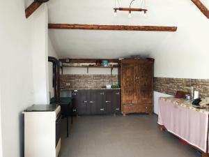 an attic kitchen with a table and a counter at LA GRADINA 