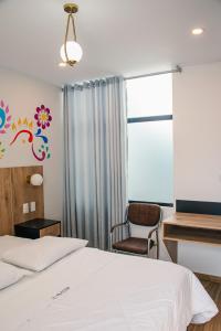 Postel nebo postele na pokoji v ubytování Platero Hotel