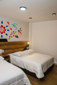 Postel nebo postele na pokoji v ubytování Platero Hotel