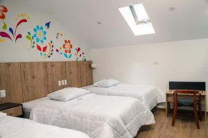 Postel nebo postele na pokoji v ubytování Platero Hotel