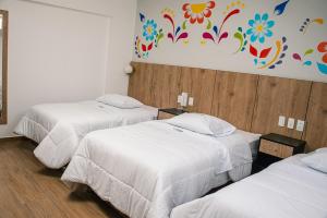 Postel nebo postele na pokoji v ubytování Platero Hotel