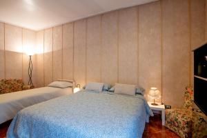 Postel nebo postele na pokoji v ubytování Barocco Room Wi-Fi