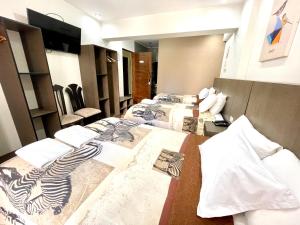 Postel nebo postele na pokoji v ubytování Hotel Coronado