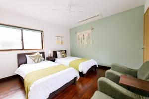 Un pat sau paturi într-o cameră la 翡翠-Jade-