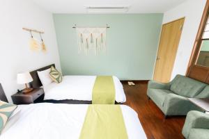 Postel nebo postele na pokoji v ubytování 翡翠-Jade-