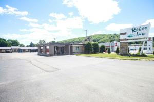 a parking lot in front of a building at Relax Inn-Bradford in Bradford