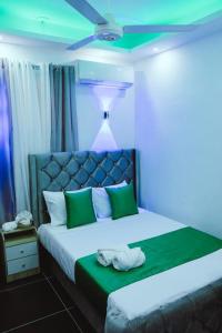 Postel nebo postele na pokoji v ubytování Hotel Reloj