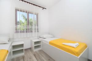 Ένα ή περισσότερα κρεβάτια σε δωμάτιο στο Apartments Vita Niko
