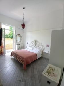 a bedroom with a bed and a large window at Beatrice Room Bed&Breakfast in Sant'Agnello