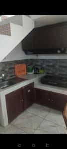 a kitchen with a sink and a counter top at ZG Home Solo in Bonorejo