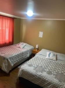 Кровать или кровати в номере Hostal El Salitre