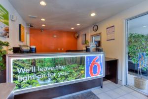 a fish tank in a store with a sign at Motel 6-Tigard, OR - Portland South - Lake Oswego in Tigard