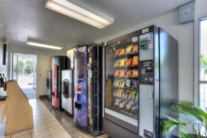 a grocery store with a vending machine filled with drinks at Motel 6-Tigard, OR - Portland South - Lake Oswego in Tigard