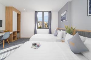 Tempat tidur dalam kamar di Davue Hotel by THG