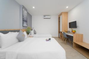 Tempat tidur dalam kamar di Davue Hotel by THG