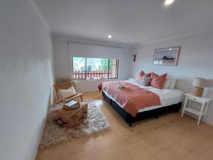 a bedroom with a bed and a window at House Matterhon 3 Bedroom Apartment in Jindabyne
