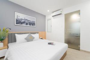 Tempat tidur dalam kamar di Davue Hotel by THG