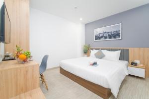 Tempat tidur dalam kamar di Davue Hotel by THG