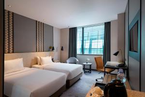 Cama ou camas em um quarto em Anara Airport Hotel