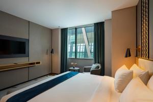 Cama ou camas em um quarto em Anara Airport Hotel