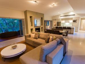 a large living room with a couch and a table at Flutes Escape - luxury stay, Margaret River in Wilyabrup