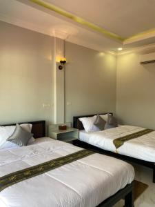 Cama o camas de una habitación en H3 Guesthouse