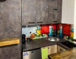 a kitchen with a sink and a counter top at Puro Urban in Ohrid