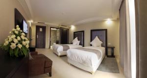 Postel nebo postele na pokoji v ubytování Tempoo Hotel Marrakech City Centre Adults Only