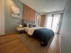 A bed or beds in a room at Prime suites - Casablanca corniche