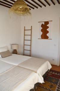 Кровать или кровати в номере Casa Basilio