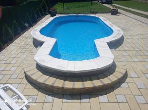 a swimming pool with a circularvisor around it at vikendaja in Rakovac