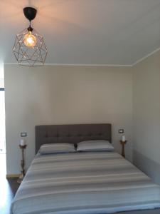 Een bed of bedden in een kamer bij Suite Onorio B&B Zia Vivina
