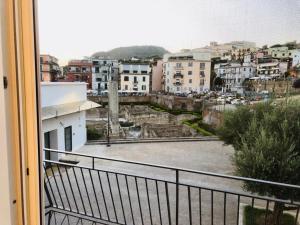 a view of a city from a balcony at B&B Historia in Pozzuoli