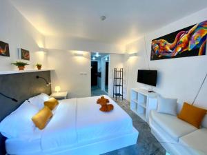 Ένα ή περισσότερα κρεβάτια σε δωμάτιο στο STUDIO DESIGN 5 ETOILES Resort