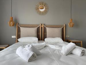 Ένα ή περισσότερα κρεβάτια σε δωμάτιο στο Litsa Apartments