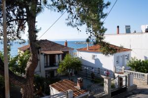 a house with a view of the ocean at Our parent's house. Family house for rent in Skala Kallirakhis