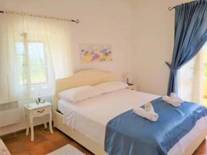 Postel nebo postele na pokoji v ubytování Villa Natura