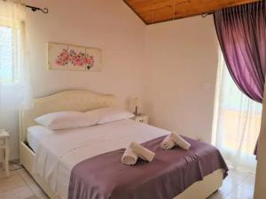Postel nebo postele na pokoji v ubytování Villa Natura