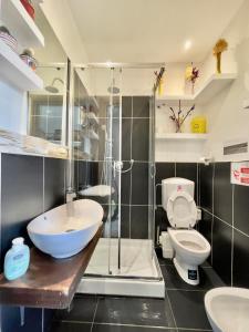 a bathroom with a sink and a toilet and a shower at Guest House Biffi Simone in Florence