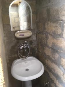 a bathroom with a white sink and a mirror at Ambar in Nova Varoš
