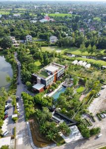 an aerial view of a resort with a river and trees at North Hill City Resort -SHA Extra Plus in Hang Dong