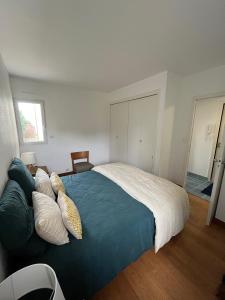 Posteľ alebo postele v izbe v ubytovaní Appartement - vue mer