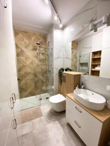 Salle de bains dans l'établissement Sea Apartament - Plac Unii