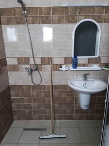 a bathroom with a shower and a sink at S 2 1km from the beach in Kelibia in Kelibia