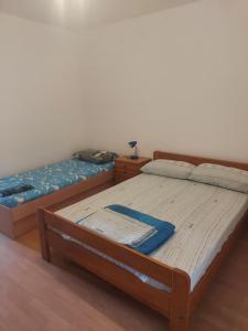 A bed or beds in a room at Apartments Vilanija