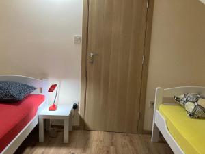 Postel nebo postele na pokoji v ubytování Podgorica-Downtown